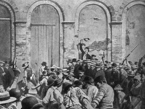 image of mob using a battering ram to break the parish prison's doors