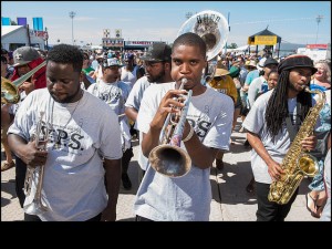 Y.P.S. Brass Band rolling with Big Stepper members parade during Jazz Fest 2016