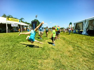 A young fan jumps for joy at Jazz Fest 2016 [Photo by Eli Mergel]