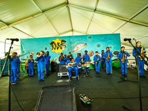 Young Audiences Brass Band performs in the Kids Tent at Jazz Fest 2016 [Photo by Eli Mergel]