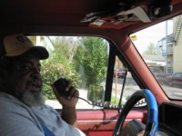 A simple Radio Shack bullhorn brings Okra's call to the neighborhood