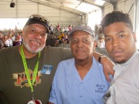 Another longtime WWOZ DJ, Michael Gourrier (Mr. Jazz) with Clinton Scott and his grandson, jazz musician Christian Scott aTunde Adjuah at Jazz Fest  [Photo courtesy Mike Gourrier]