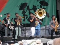 New Breed Brass Band with Trombone Shorty at Jazz Fest 2024 [Photo by Louis Crispino]